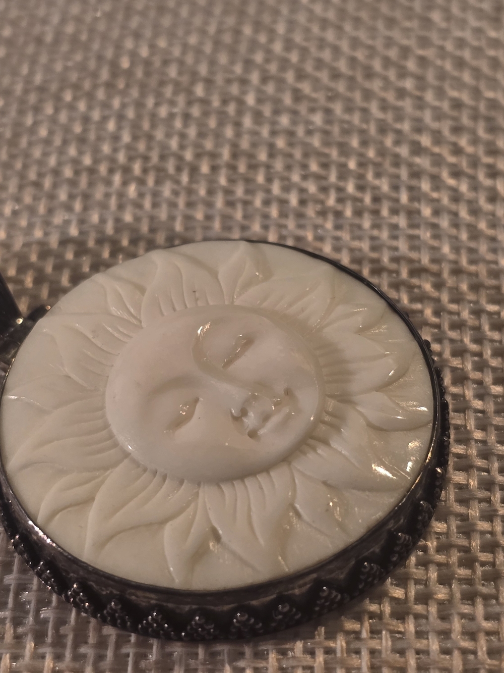 White Sun Face Carved Pendant with Silver-Tone Frame